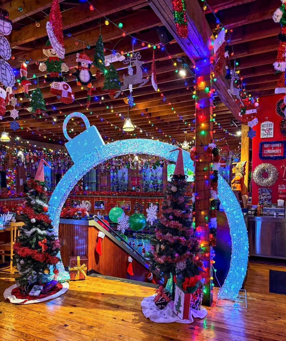 A giant illuminated ornament photo-op installation